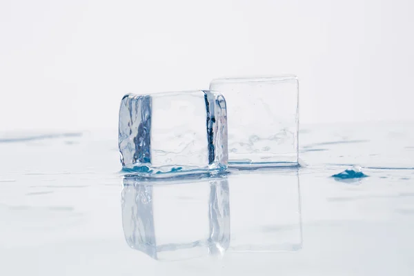 Ice cube on table — Stock Photo, Image