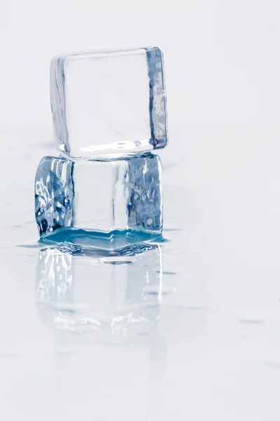 Ice cube on table — Stock Photo, Image