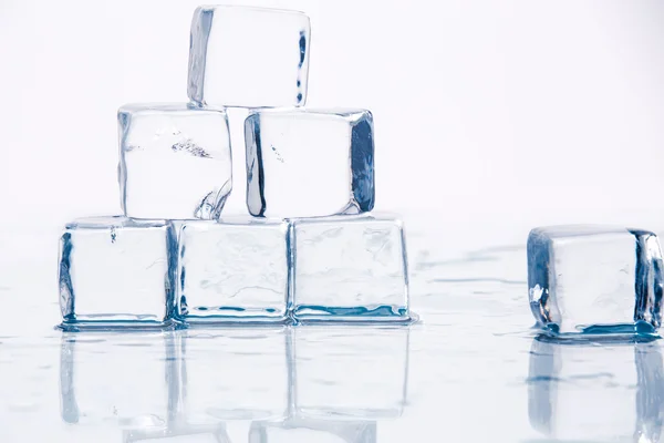 Ice cubes on table — Stock Photo, Image