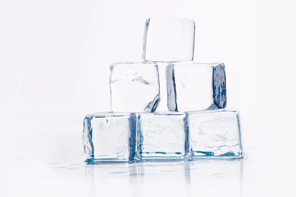 Ice cubes on table — Stock Photo, Image