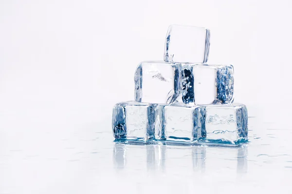 Ice cubes on table — Stock Photo, Image