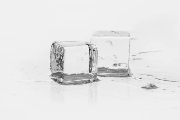 Ice cube on table — Stock Photo, Image