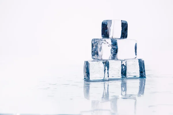 Ice cubes on table — Stock Photo, Image