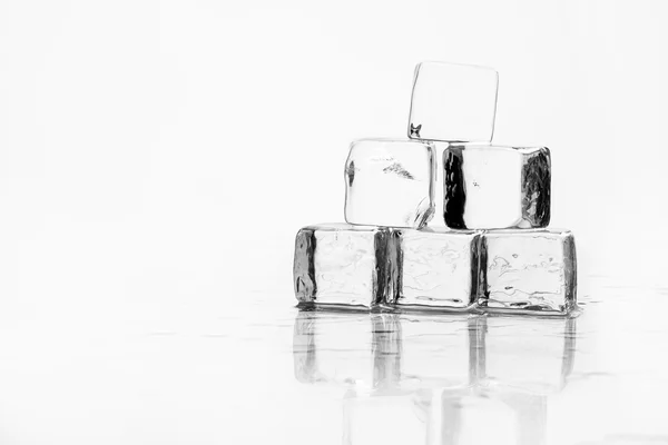 Ice cube on table — Stock Photo, Image