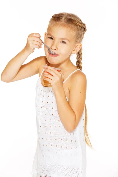 Little girl eating jello — Stock Photo, Image