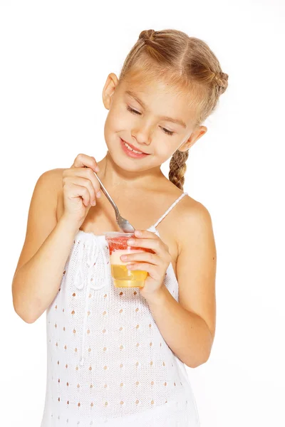 Little girl eating jello — Stock Photo, Image