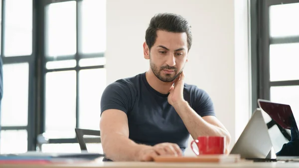 Portrait of freelancer or office man having headaches, stressful of work, depressed or having a fever while working at the office, the concept of pressure from work, working lifestyle, stressful work.