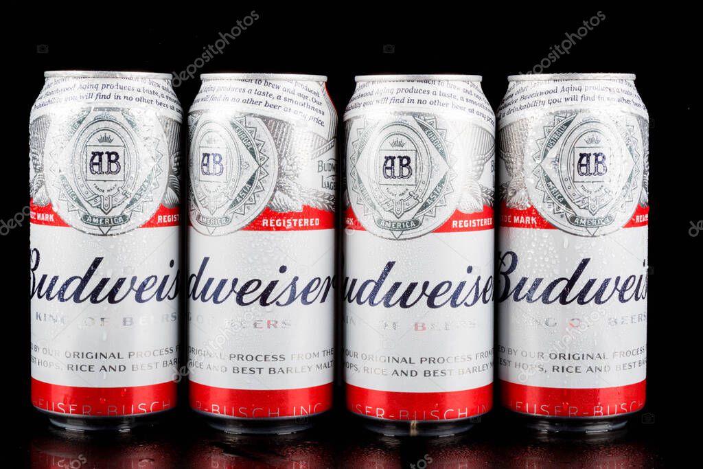 Sandhurst, United Kingdom; February 13th 2021:- Four cans of Budweiser isolated on a black background