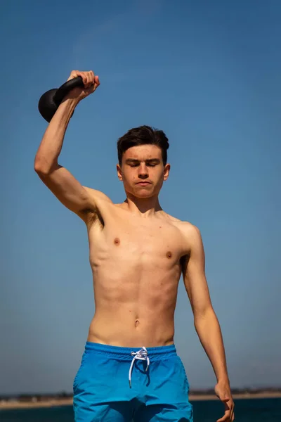 Year Old Caucasian Shirtless Teenage Boy Swimwear Exercising Kettlebell Weight — Stock Photo, Image