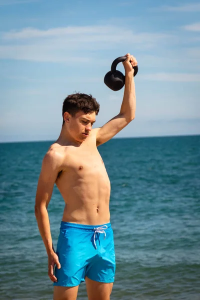 Year Old Caucasian Shirtless Teenage Boy Swimwear Exercising Kettlebell Weight — Stock Photo, Image