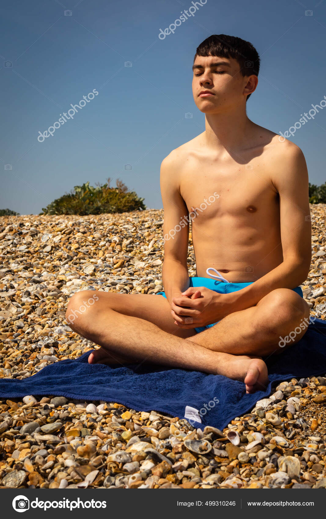 Year Old Caucasian Shirtless Teenage Boy Beach Meditating Wearing Swim  Stock Photo by ©Triumph0828 499310246