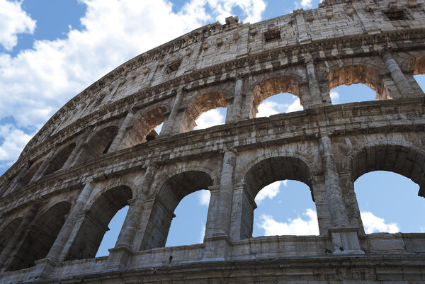 Coliseum of rome, blu sky clouds
