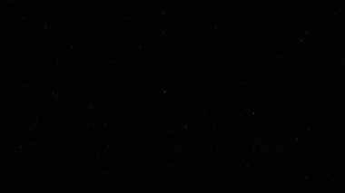 Toz parçacıkları arka plan. Tahıl dokusu. Yoğunlaşmamış beyaz toz karanlıkta uçuyor..