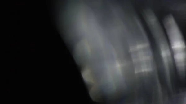 Karanlıkta 4k Soyut Kristal Bokeh. Düzenleme için arkaplanı üst üste koy. Işık Sızıntısı 4K görüntüsü