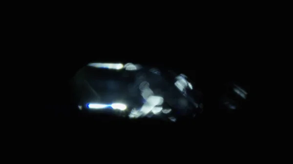 Karanlıkta 4k Soyut Kristal Bokeh. Düzenleme için arkaplanı üst üste koy. Işık Sızıntısı 4K görüntüsü
