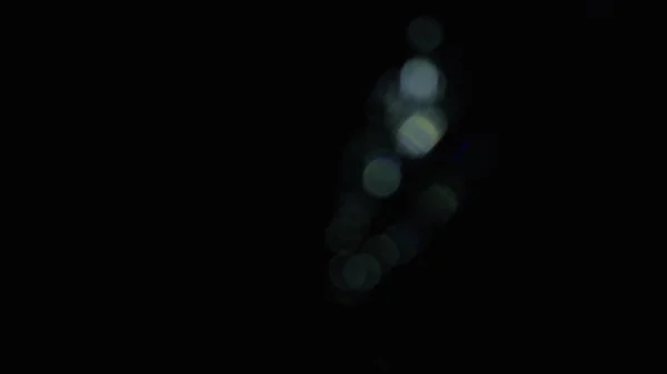 Karanlıkta 4k Soyut Kristal Bokeh. Düzenleme için arkaplanı üst üste koy. Işık Sızıntısı 4K görüntüsü