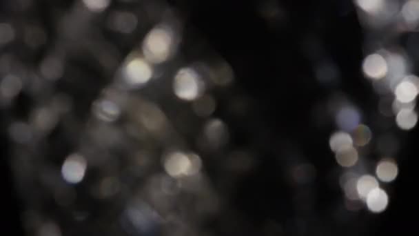 4k Bokeh cristal abstracto en la oscuridad. Fondo superpuesto para la edición. Fugas de luz luminosa — Vídeo de stock