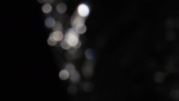 4k Bokeh cristal abstracto en la oscuridad. Fondo superpuesto para la edición. Fugas de luz luminosa — Vídeo de stock