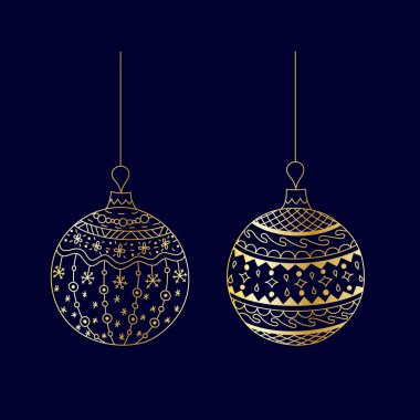 Elle çizilmiş, iplikli altın Noel oyuncağı.