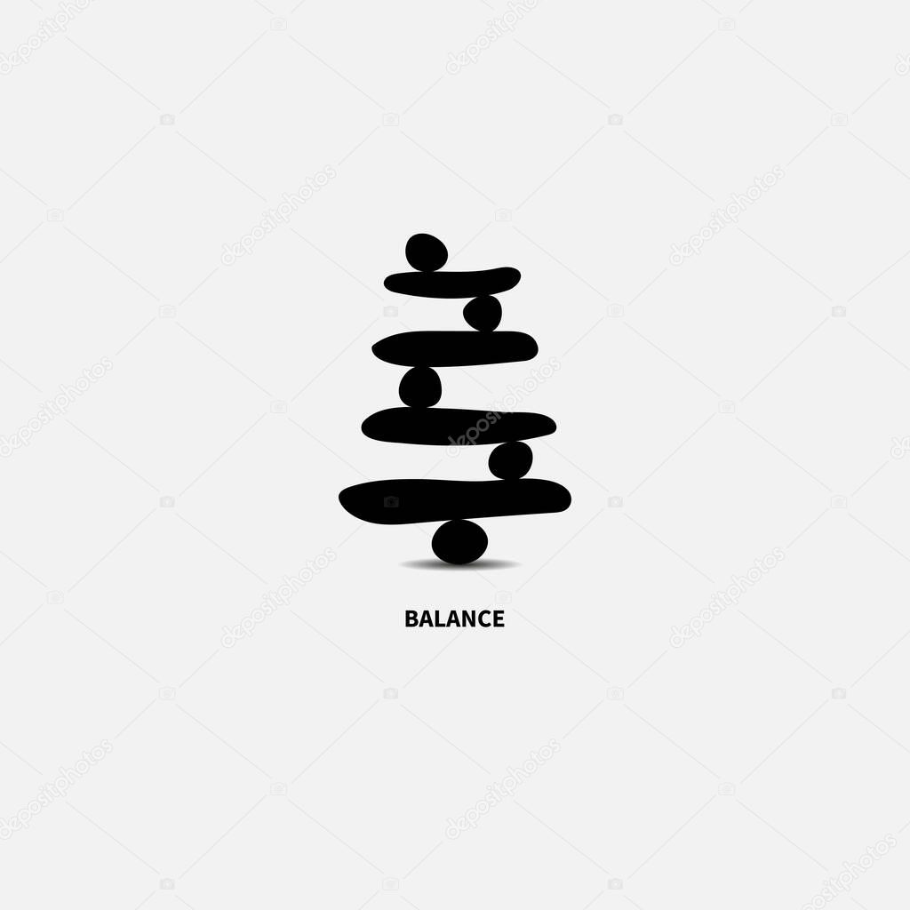 Black stones in balance, zen symbol. Logo for yoga and meditation studios