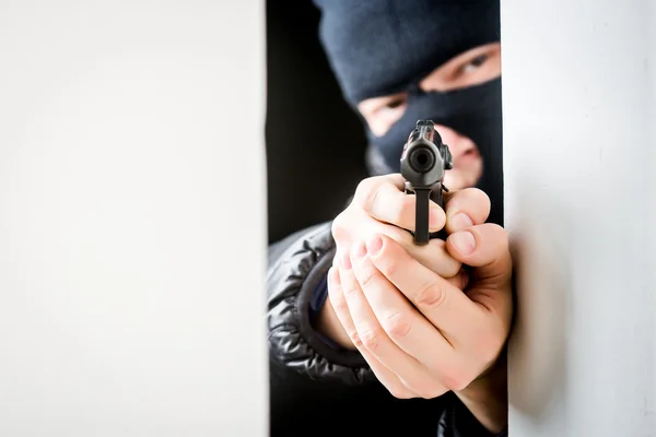 Aiming murderer with a gun — Stock Photo, Image