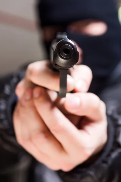 Aiming murderer with a gun — Stock Photo, Image