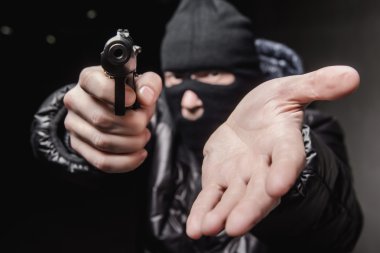 Robber with an aming gun clipart