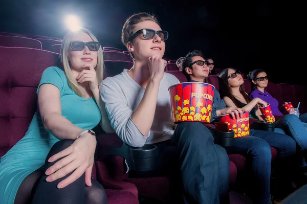 People in the cinema wearing 3d glasses Stock Photo