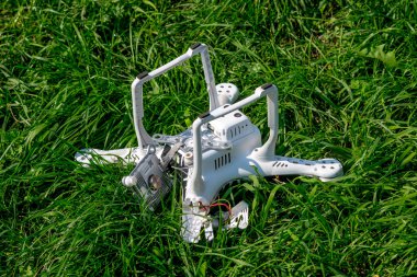 Crashed drone on the ground clipart