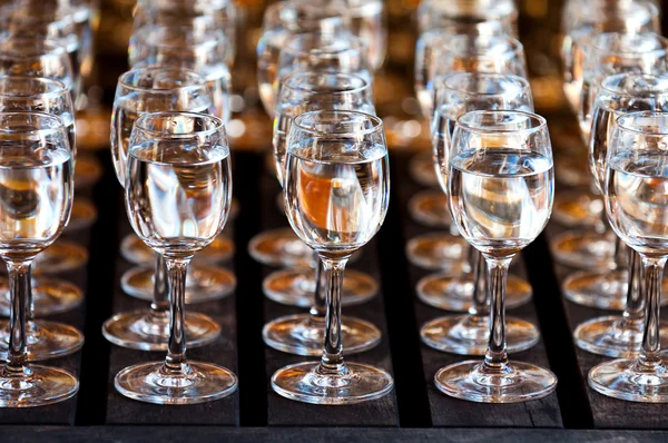 http://st2.depositphotos.com/6456500/9545/i/450/depositphotos_95454298-Glasses-of-vodka-on-wooden-table.jpg