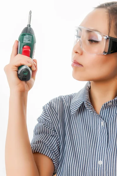 Young woman with a drill Stock Picture