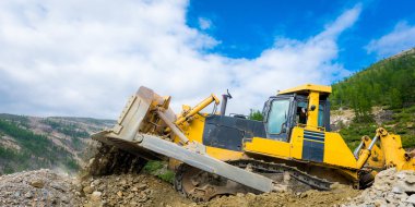 İş yerinde bir altın madeni buldozer