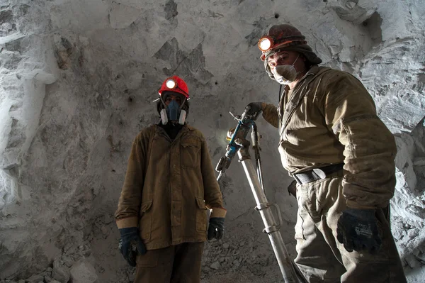 Miner inside a gold mine. — Stock Photo, Image