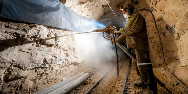 Miner inside a gold mine. — Stock Photo, Image