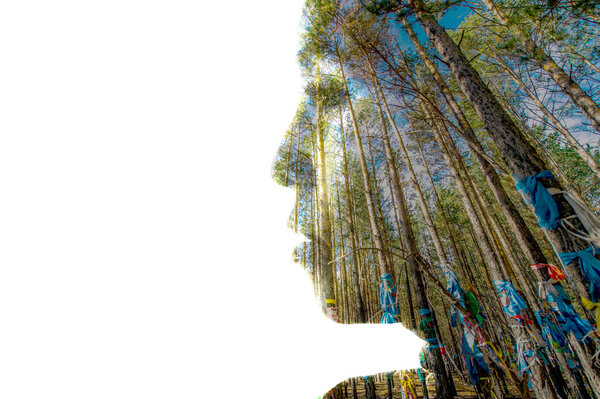 Double exposure portrait of a woman