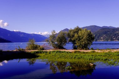beautiful reflections on the lake water in Luino