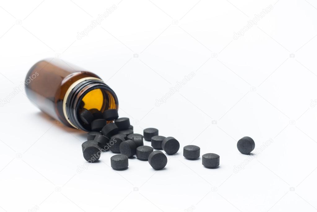 Activated carbon pills