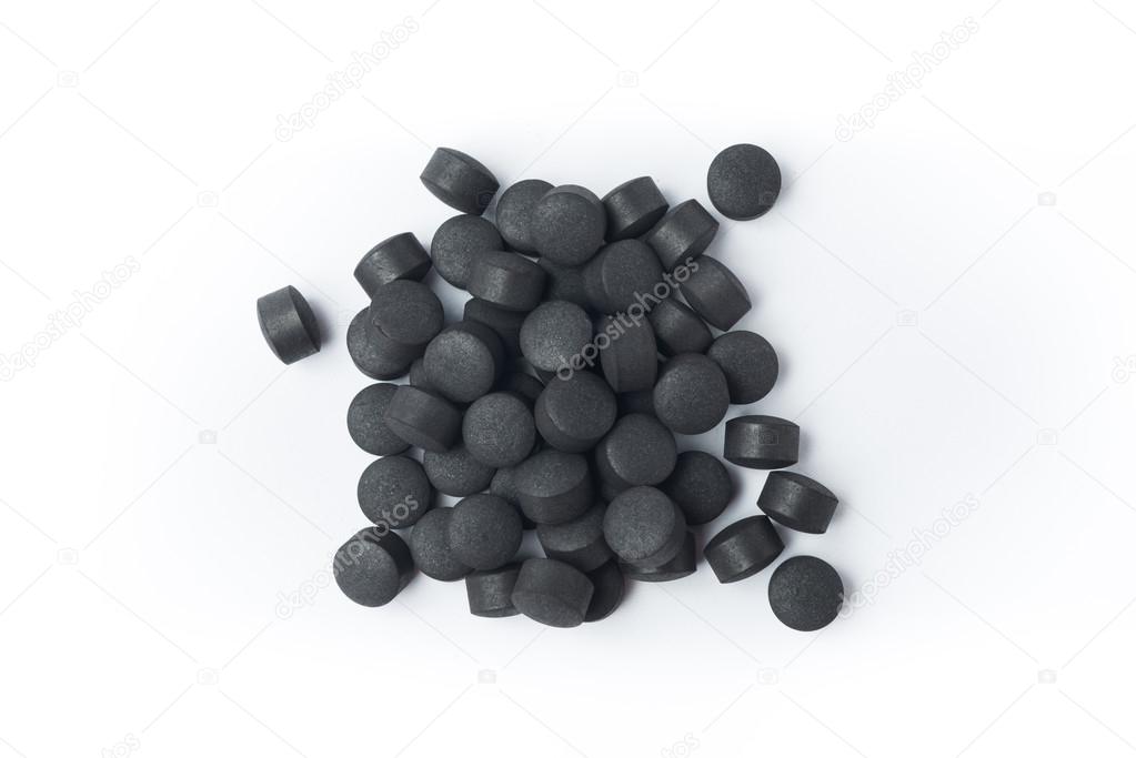 Activated carbon pills