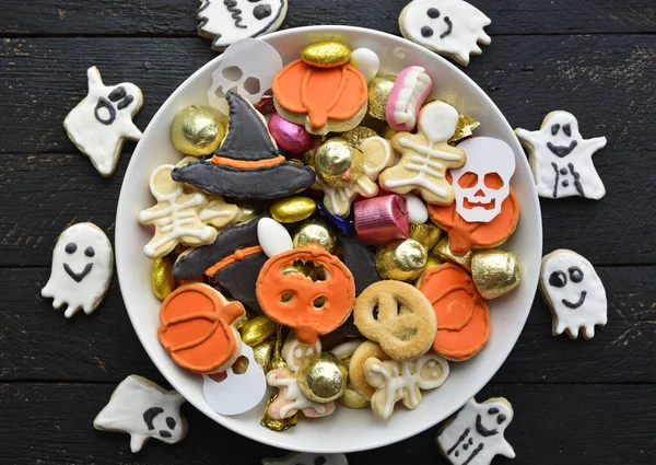 candy bowl of chocolates and sweets, Halloween Jack o Lantern cookies - Trick or Treat Halloween card background