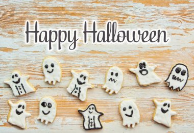 Cadılar Bayramı Jack o Lantern kurabiyeleri, balkabağı, hayalet, siyah kedi, cadı şapkası. Hile veya Tedavi arka planı