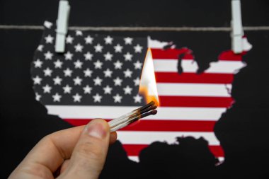 map of america USA burning match - as a symbol of incitement to crisis and chaos of division in country clipart