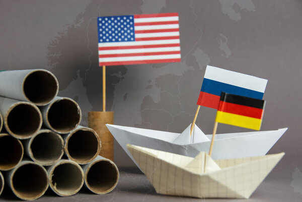 abstract vision Nord Stream 2 USA and EU sanction, gas pipes and flag of russia, germany