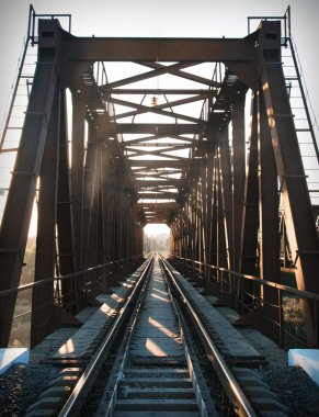 Old steel railway bridge on the river. Empty train bridge 