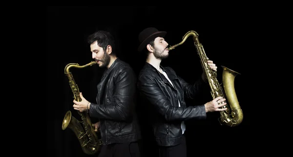 A saxophone players   dark background.  Saxophonist jazz man wit — Φωτογραφία Αρχείου