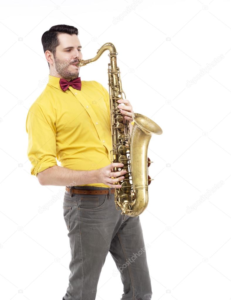 Man saxophonist playing saxophone player in studio isolated on white