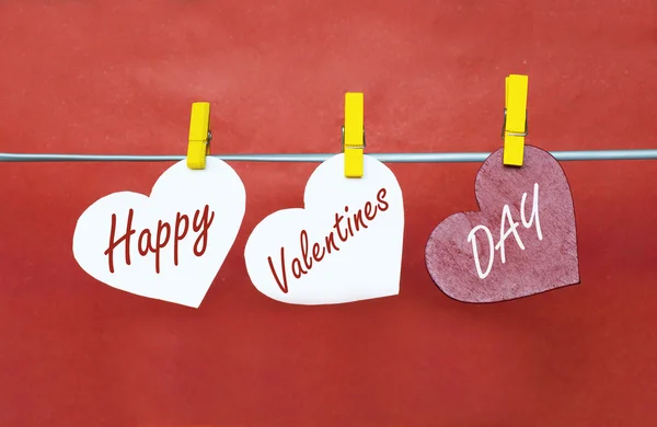 White and Red hearts with clothespins hanging on clothesline on — Stockfoto