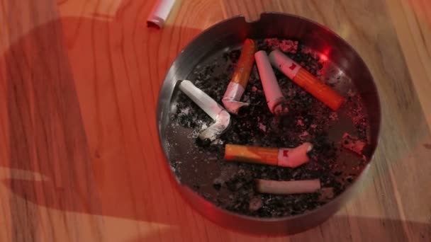 Man Bar Puts Out Cigarette Ashtray Takes New Cigarette — Stock Video