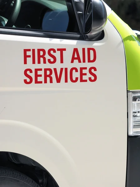 First Aid services printing on an ambulance — Stock Photo, Image