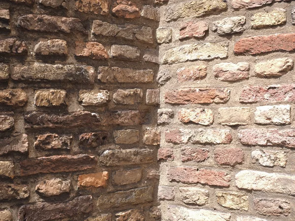 Medieval rough brick wall corner