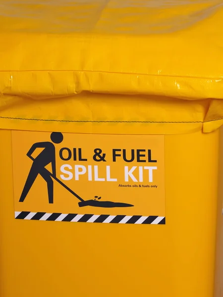 Labeled bright yellow industrial emergency spill kit — Stock Photo, Image